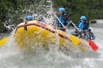 Rapid water splash into raft