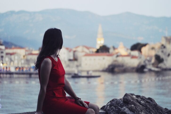 A girl overlooking Budva Old Town