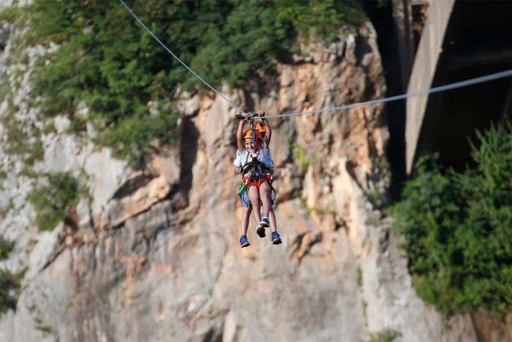 children-ziplining-together-smiling-montenegro-adventure Children ziplining together, Đurđevića Tara Bridge