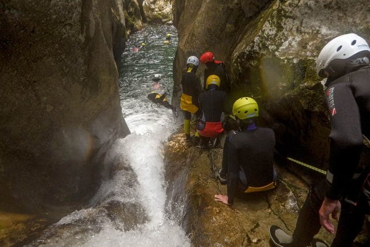 Group jumping from cliff Nevidio Canyon
