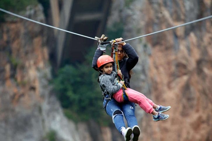 Mom and daughter enjoying extreme zipline, Tara Bridge