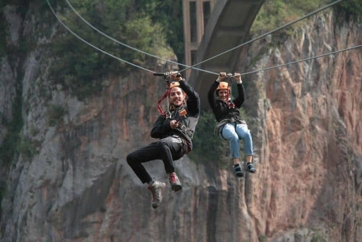 young-couple-enjoying-extreme-zipline-montenegro-adventure Young couple enjoying extreme Zipline