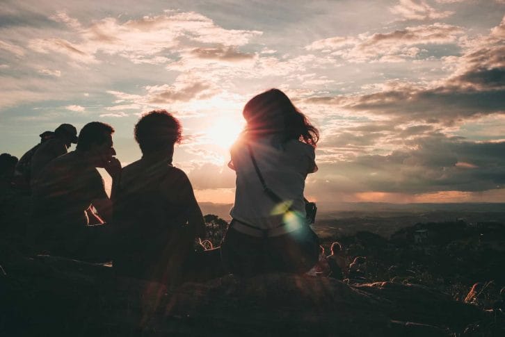 Friends having fun and enjoy at sunset