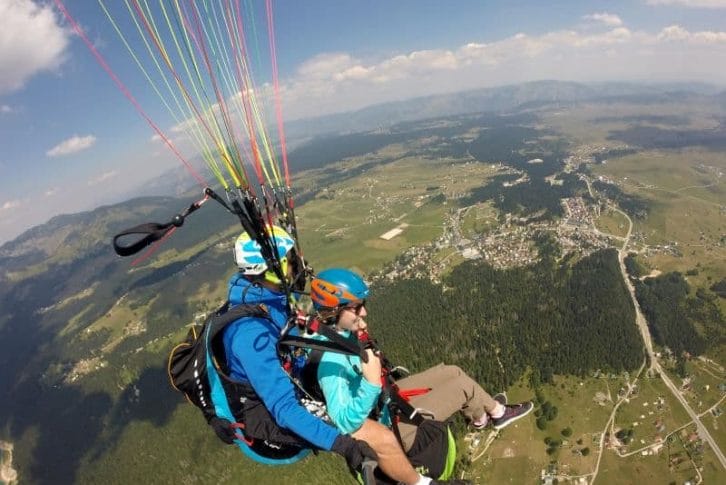 Flying over town tandem paragliding Savin-kuk