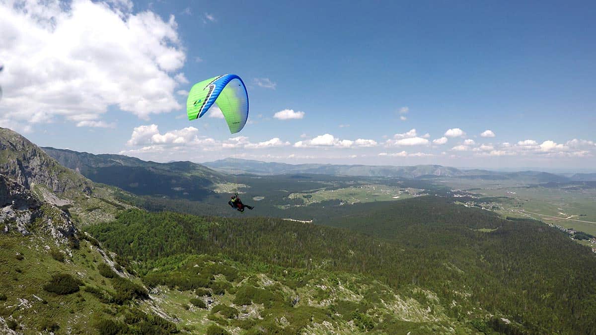 Side view panorama, beautiful sky tandem paragliding, Savin Kuk