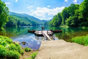 Two men enjoying the stunning view at the Biograd Lake in Montenegro