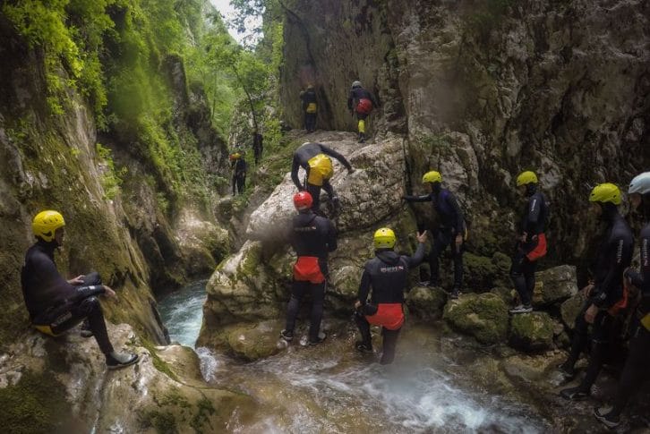 Group tourists starting canyoning Nevidio