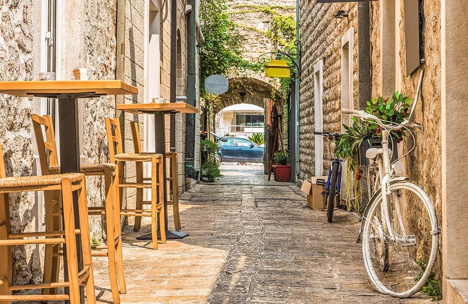 Narrow street in Budva at a cafe in Montenegro