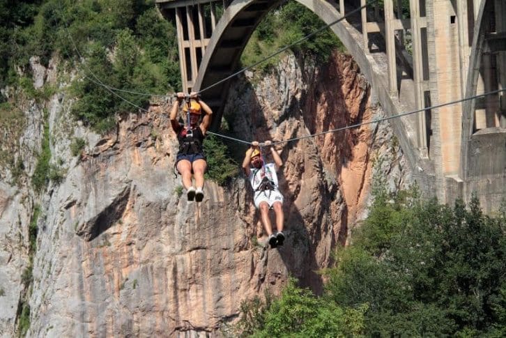 couple-in-shorts-smiling-zipline-montenegro-adventure