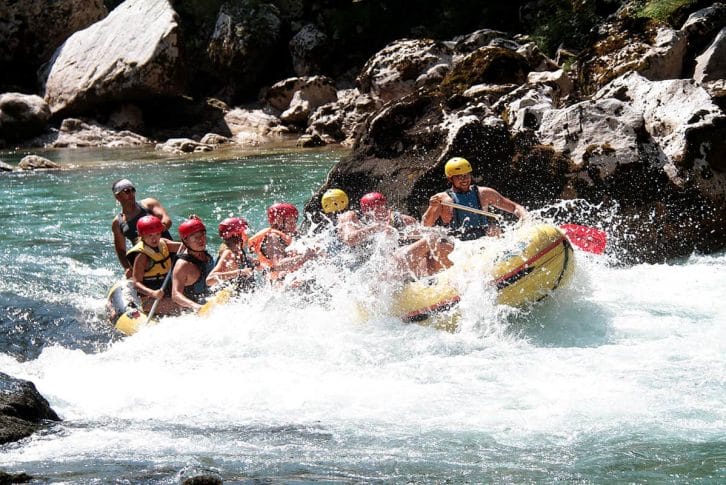 Family enjoying rapids on rafting, Tara