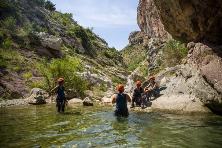 Group enjoying the sunny view and water at canyoning at Rikovac