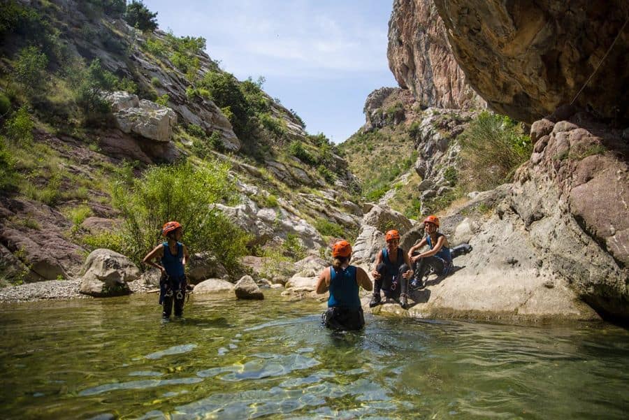 Group enjoying the sunny view and water at canyoning at Rikovac
