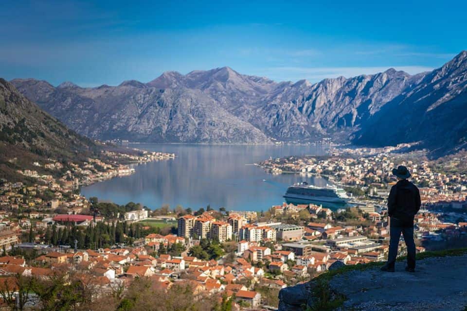 Man enjoying a stunning view of Kotor Bay in Montenegro