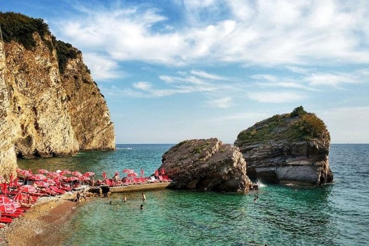 People enjoying the Mogren beach in Montenegro