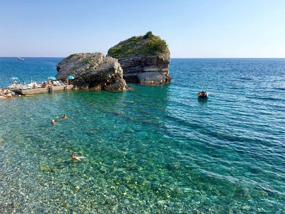 Travellers enjoying the sun and beach in Budva