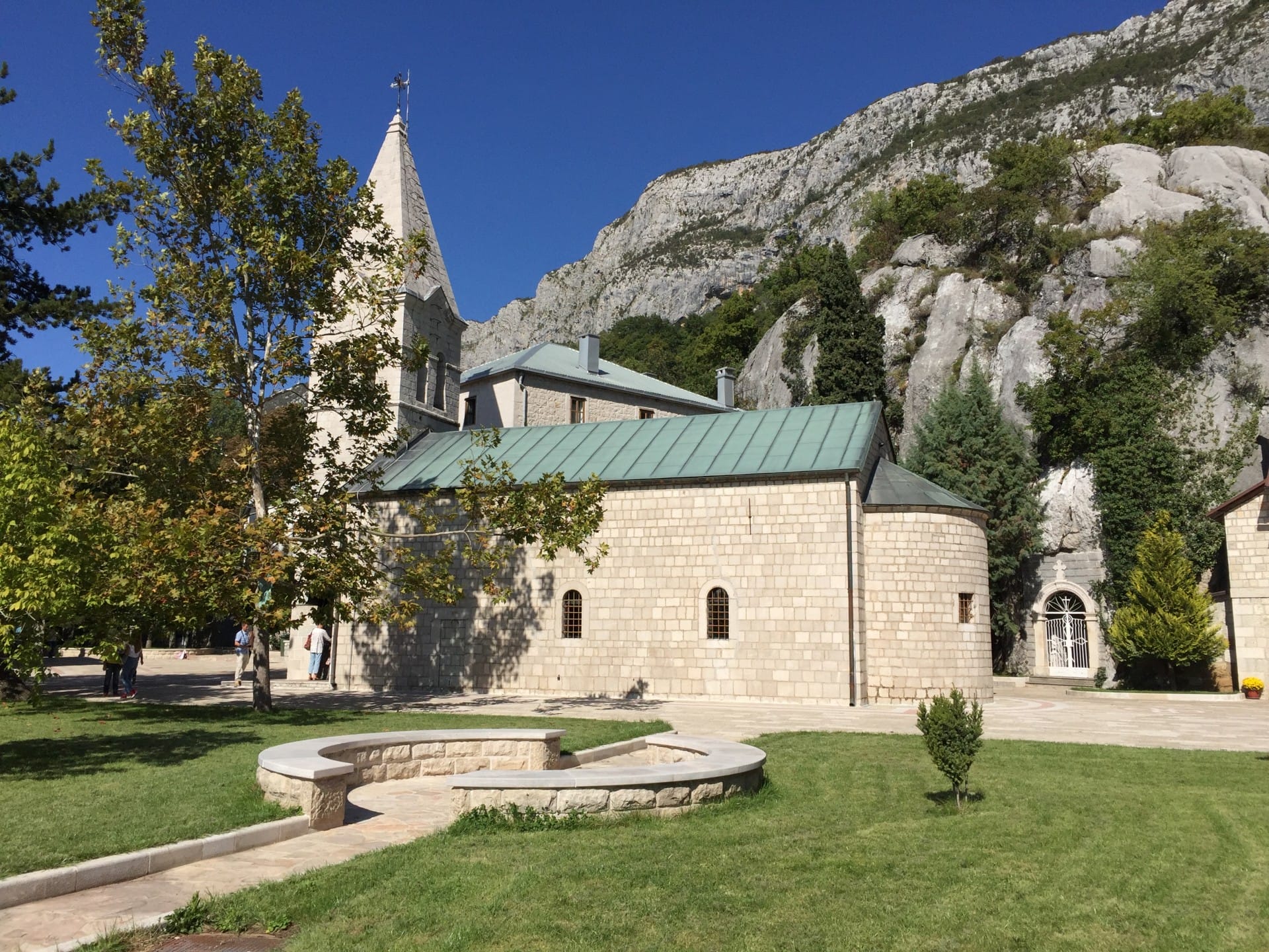 Ostrog Monastery - Holy Trinity Church green garden