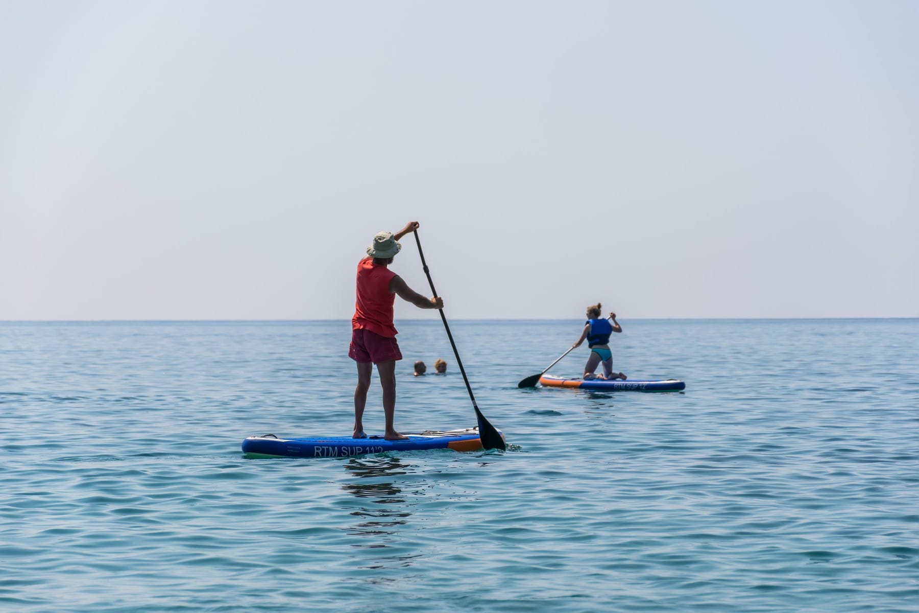 Man paddles with SUP on Adriatic sea Montenegro