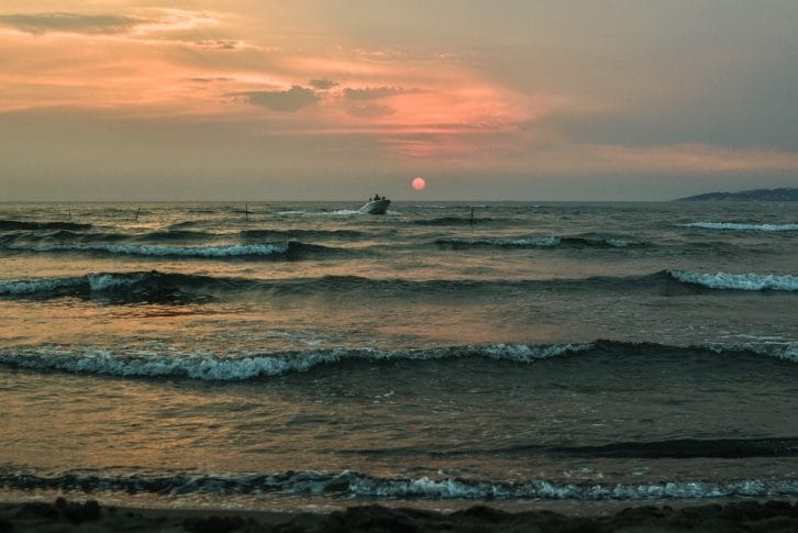 Boat cruise on waves in sunset Ada Bojana Ulcinj Montenegro