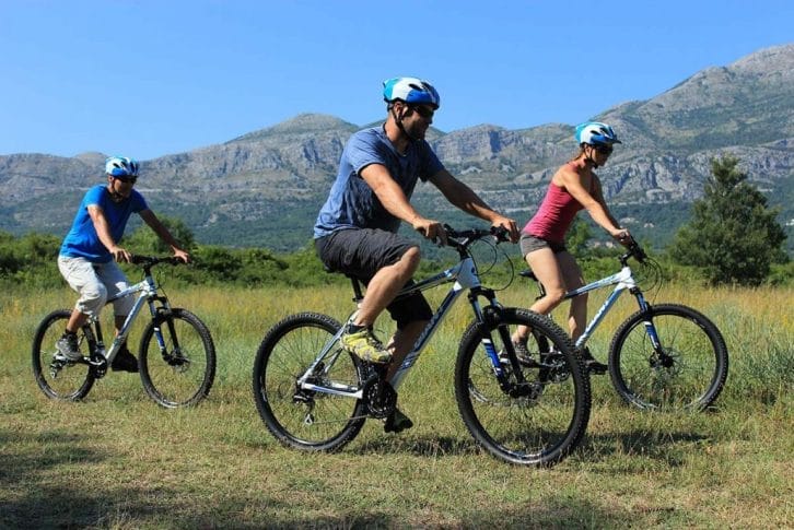 A biking through meadows in Konavle valley adventure tour