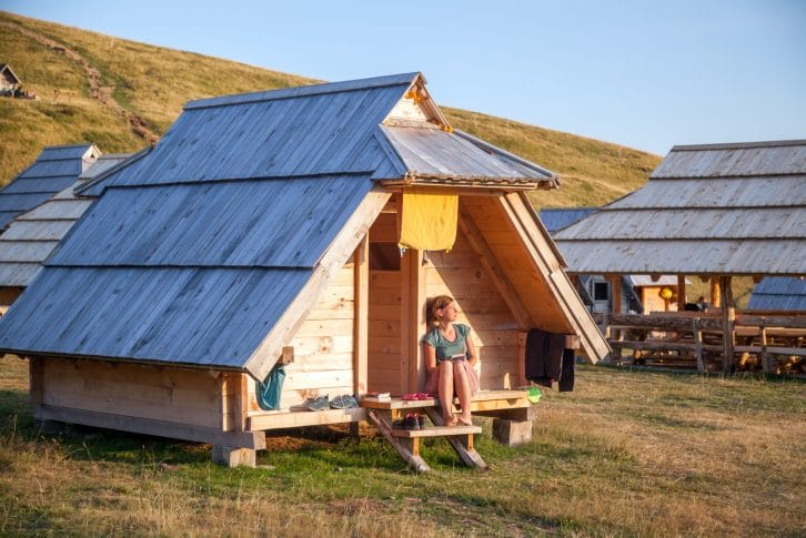 Bjelasica Vranjak Katun a girl outside the hut