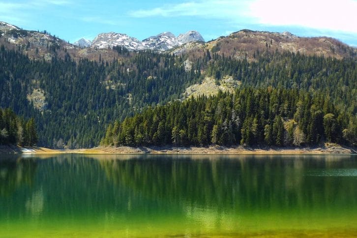 Reflections in Black Lake on Durmitor Mountain Montenegro