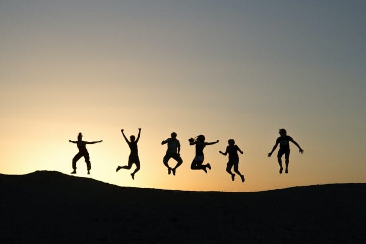 Friends jumping sunset Montenegro Adventure