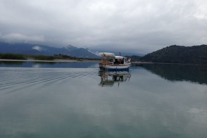 A boat cruise at Skadar Lake under a cloudy sky