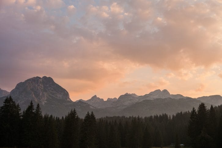 Beautiful evening mountain landscape with colourful cloud at dawn. Mount Savin Cook in the Sunset. National park Durmitor, Montenegro