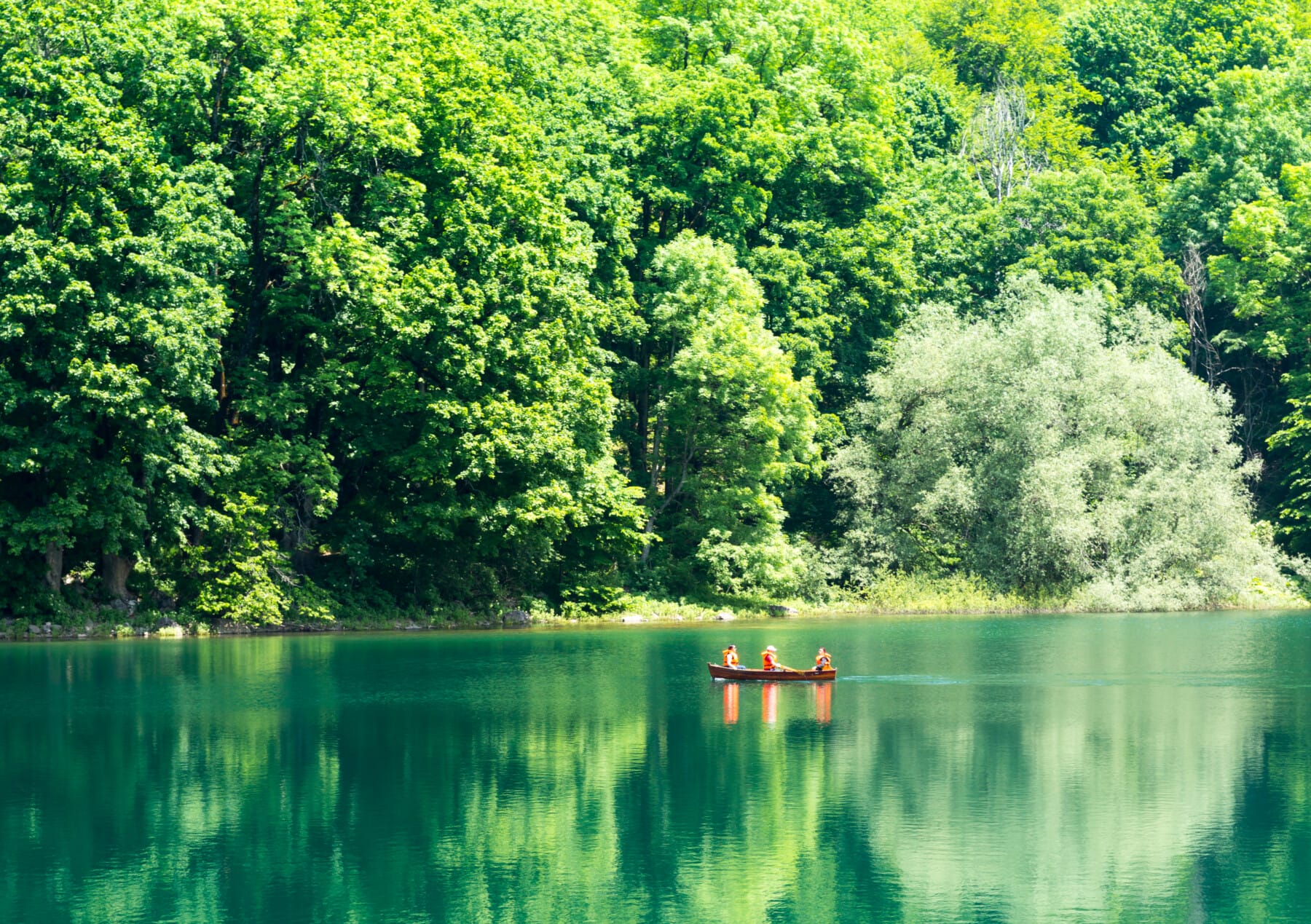 Mountain lake in Montenegro with a boat. Biograd lake, Montenegro