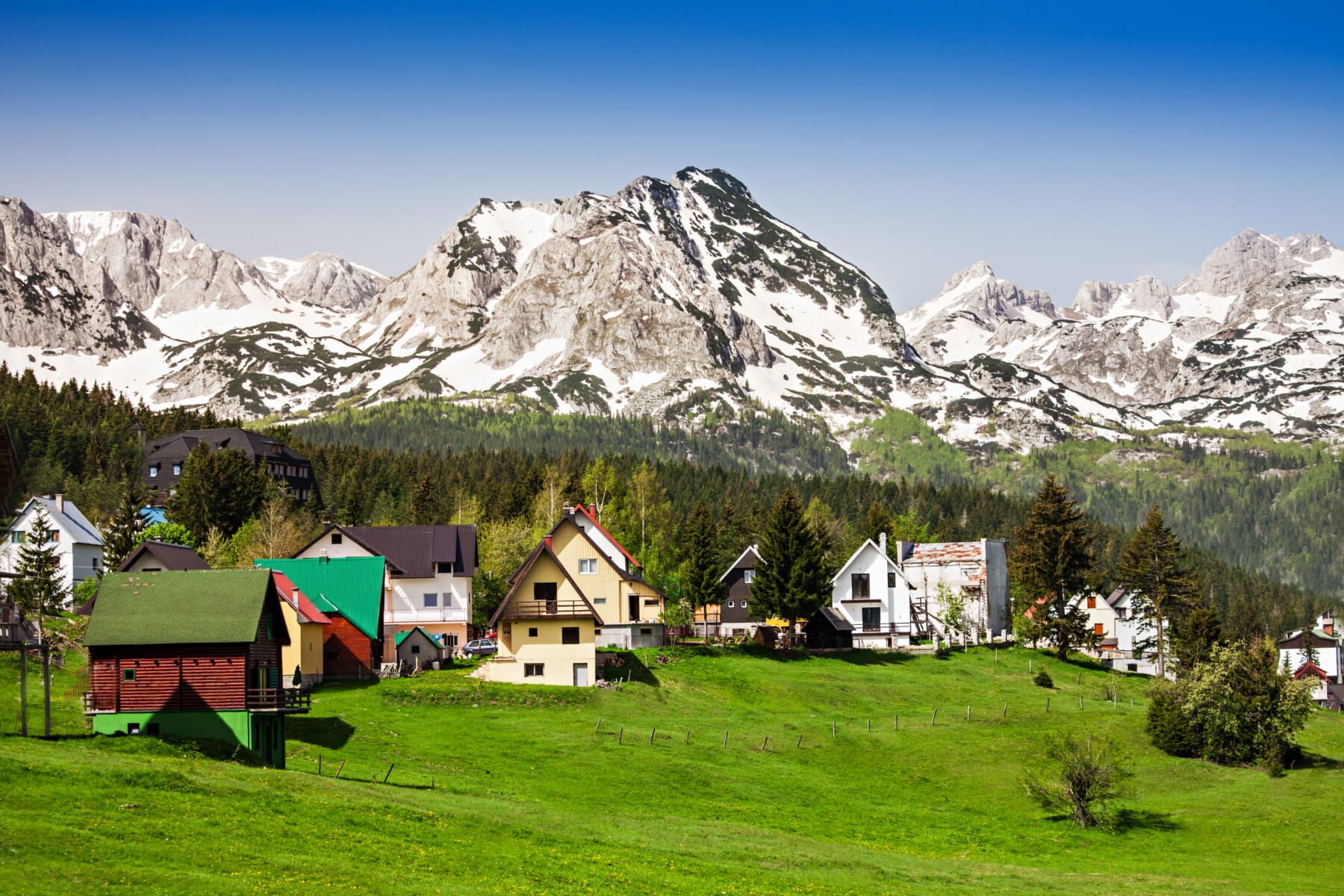 Amazing view on Durmitor mountain and houses under mountain, Žabljak