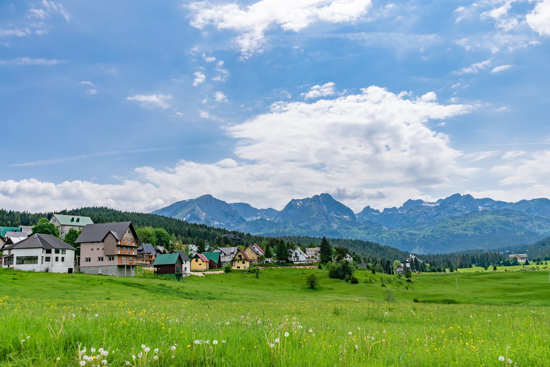 A picturesque green valley among the high mountains.