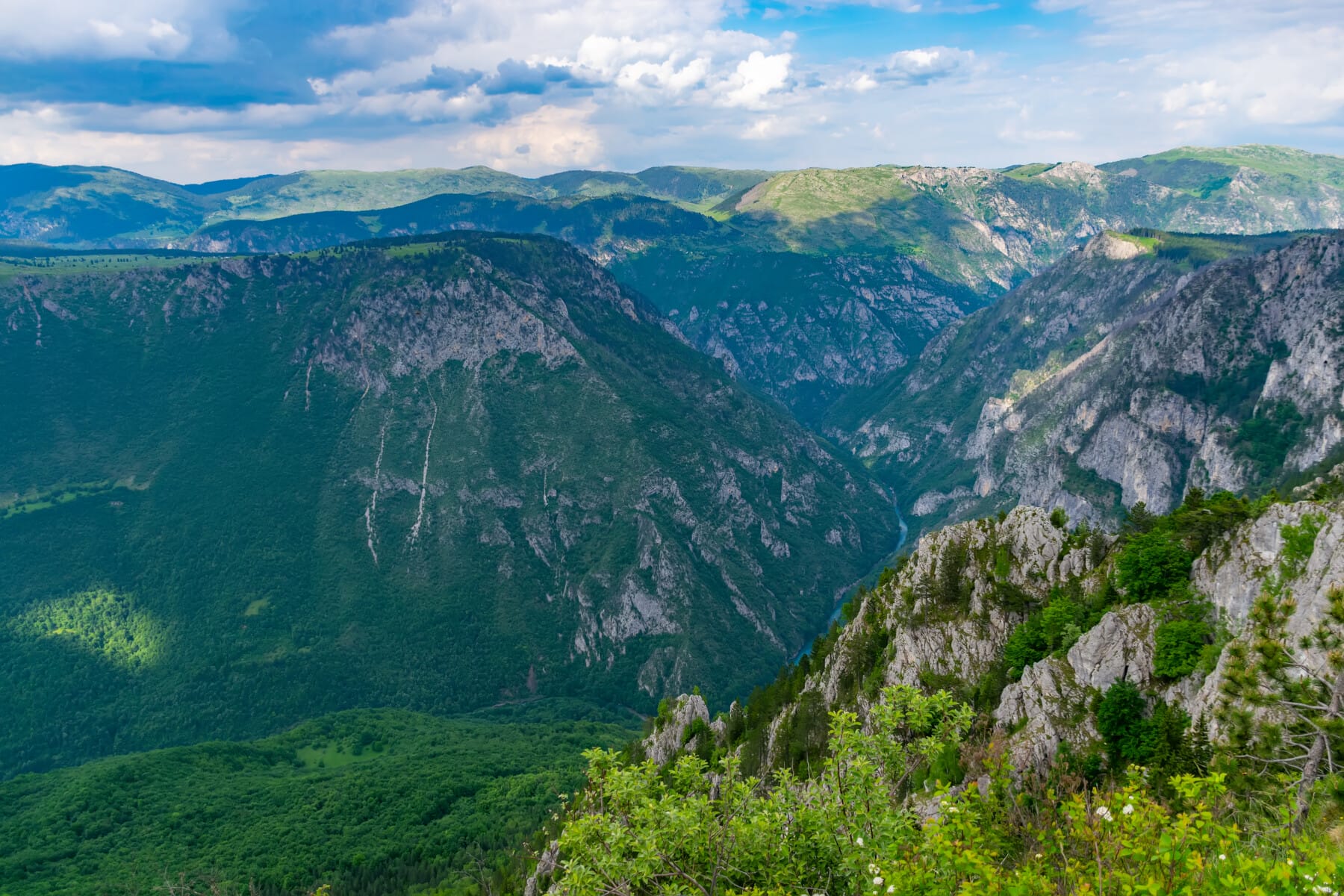 The river Tara flows at the depth of the canyon among the mountains.