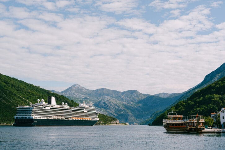 A tall, high-rise huge cruise liner in the Verige Strait, in the Boko Kotor Bay in Montenegro