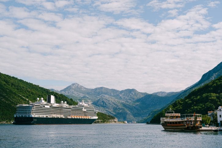A tall, high-rise huge cruise liner in the Verige Strait, in the Boko Kotor Bay in Montenegro