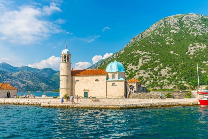 Tourists sailed on a yacht to the island of Gospa od Skrpela in the Boka Bay of Kotor
