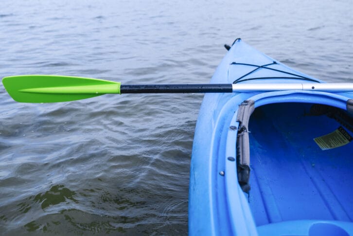 Kayak heading out into still water