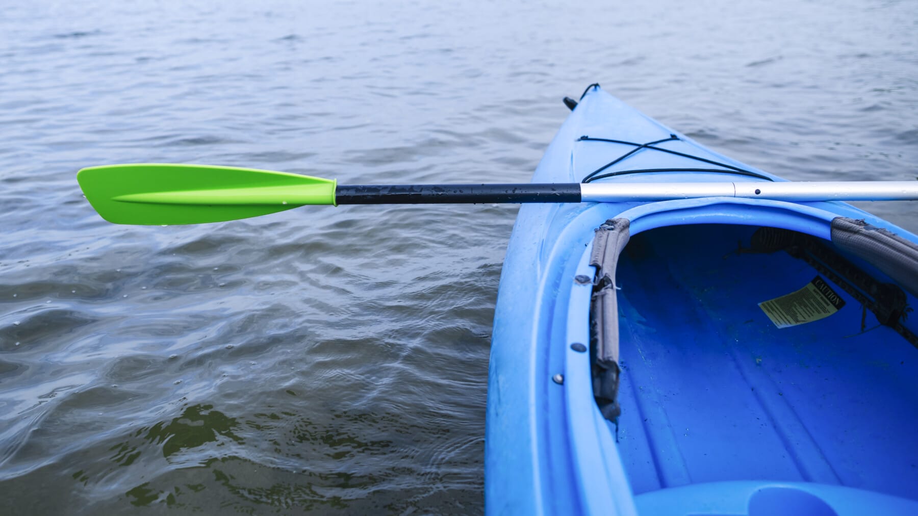 Kayak heading out into still water