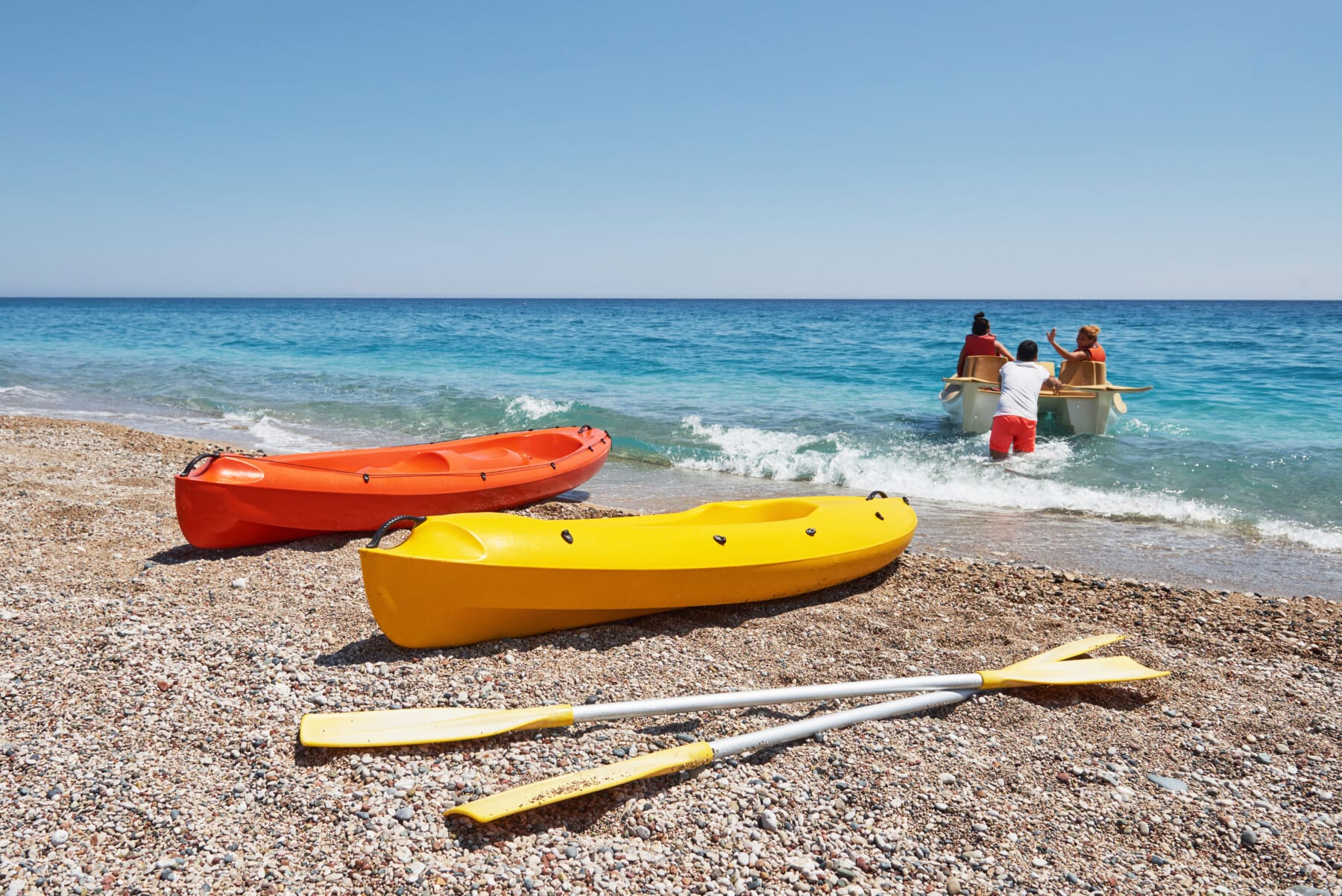 Colorful kayaks on the beach. Beautiful landscape