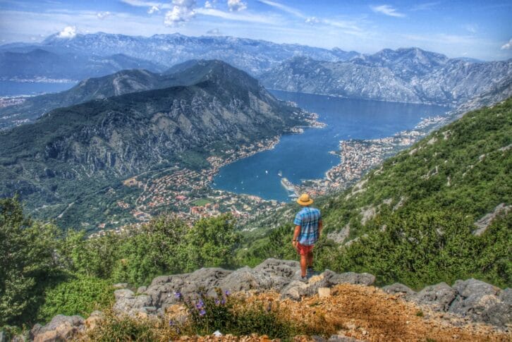 Man enjoys the panoramic view of Boka Bay in Montenegro