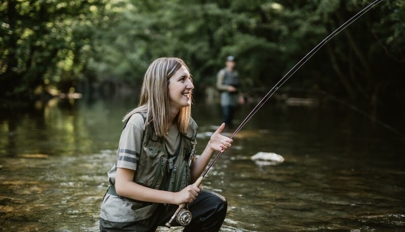 Girl fly fishing river Gradac