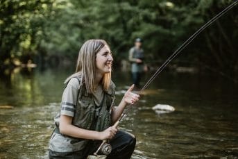 Girl fly fishing river Gradac