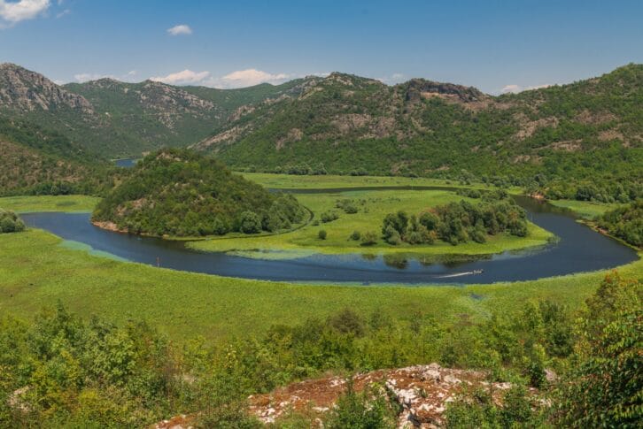 Panoramic view from above of Skadar lake and Crnojevica river in a national park, Montenegro, in a sunny summer day